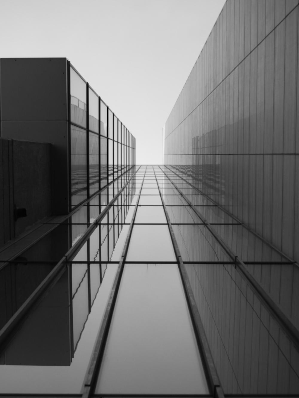 A vertical shot of a modern stairway in a beautiful white building